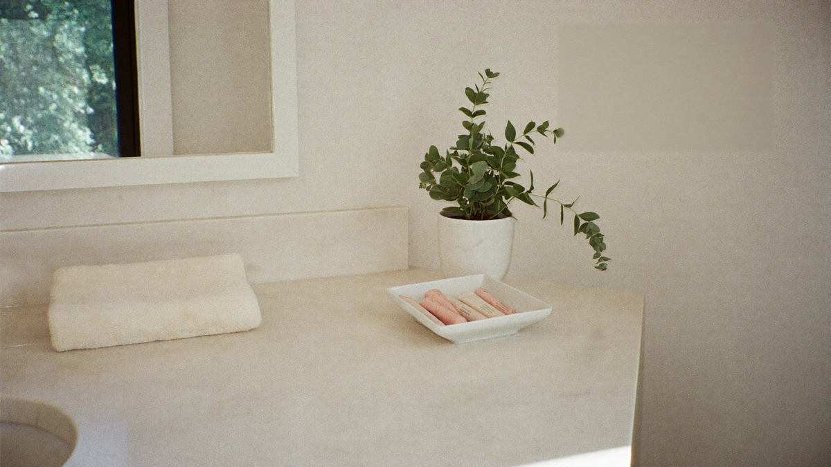 A calm, uncluttered bathroom vanity in soft morning light